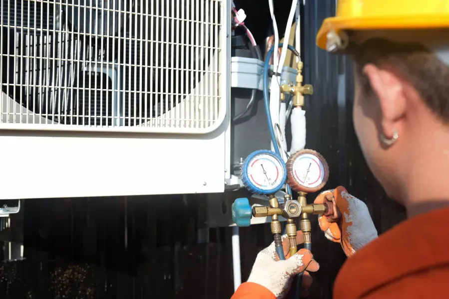 Engineer servicing a commercial air conditioning system