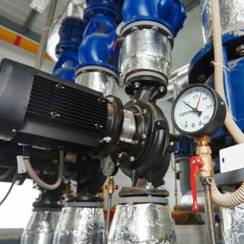 Gas Safe registered engineer inspecting commercial gas boiler and heating system